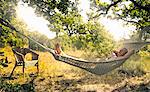 Man relaxing in hammock outdoors