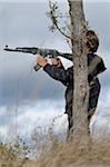 Boy Holding Rifle