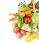 fresh vegetables with green leaves in the basket isolated on white background