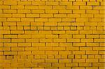 The Background with old yellow painted brick wall