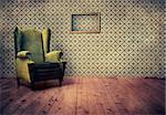 Vintage room with wallpaper and old fashioned armchair