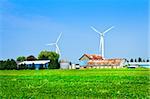 Green alternative clean power wind turbines on farm