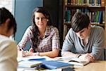 Young adults studying in a library