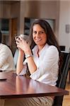 Portrait of a young woman having a coffee in a cafe