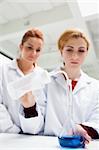 Portrait of serious science students doing an experiment in a laboratory