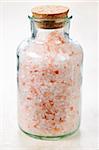 Pink bath salts in a glass jar