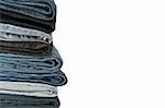 A pile of jeans on a white background