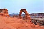 Delicate arch at Arches National Park Utah with La Sal mountains in the background