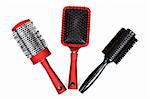 Three red massages comb on white background