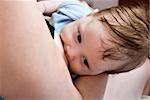 Newborn baby breast feeding breast