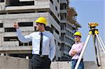 Team of architects people in group  on construciton site check documents and business workflow