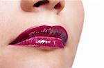 Girl's lips with dark red lipstick closeup