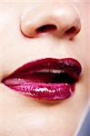 Girl's lips with dark red lipstick closeup