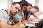 Students sitting for an examination in an amphitheater