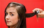 Woman having her hair rolled with a curler