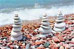 Three rock pyramids on the seashore