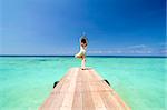 asian yogo on beautiful beach ,standing pose