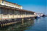 Old stores on a dock in harbor