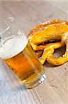 Typical crusty german pretzel bread with beer