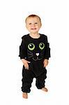 Baby girl dressed in a halloween cat costume on white background