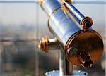 closeup of a telescope on the eiffel tower