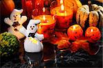 Halloween candle-light with pumpkins on black background
