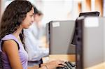 Cute student using a computer in an IT room