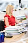 Woman working happily at her desk
