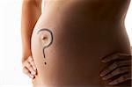 Detail Of Pregnant Woman With Question Mark On Stomach
