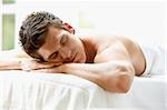 Young Man Relaxing On Massage Table