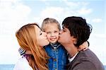 Young family at the beach in fall.