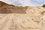 Sand pit. Sand special for construction. Pit full of fine sand and truck tracks.