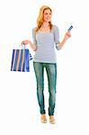 Full length portrait of attractive teengirl with shopping bags and credit card