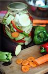 chopped carrot on a wood board and other vegetables ,shallow dof