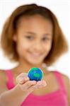 Young Girl Hoiding Small Globe