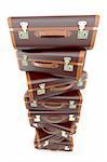 High quality 3d image of  a pile of vintage dark suitcases