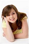 Young Girl Lying On Stomach In Studio