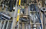 work tools in drawer: drill, screwplate, thread cutter, reamer