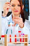 Medical doctor woman conducting tests in laboratory