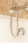 Faucet with two handles and white bath