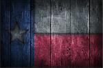 texas flag on old wooden wound