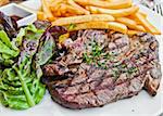 juicy steak beef meat with french fries