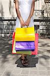 brunette woman with white dress walking in Madrid city Spain