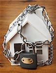 house with chain and padlock, home security concept