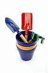 Set of gardening tools and pots