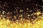 Image of Golden Christmas Lights and Stars Background