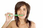 Young woman brushing her teeth on white background