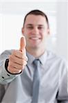 Close up of businessman giving thumbs up