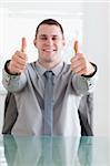 Close up of young businessman giving thumbs up