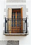 The Renovated Facade of the Old Spanish House with Balcony